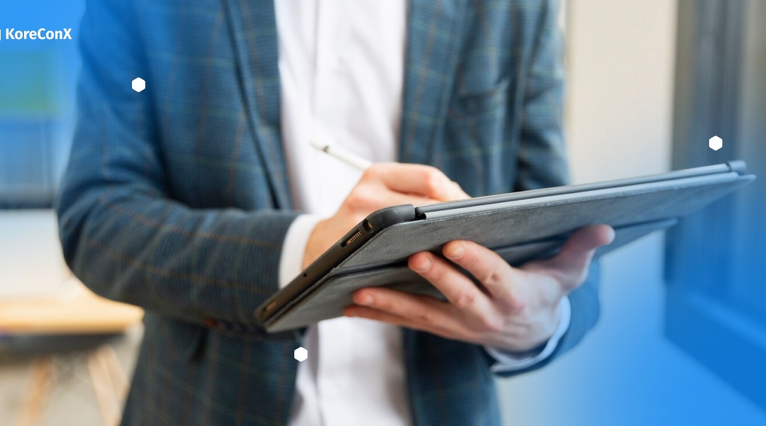 Image of a person holding a tablet, researching what is an escrow provider.